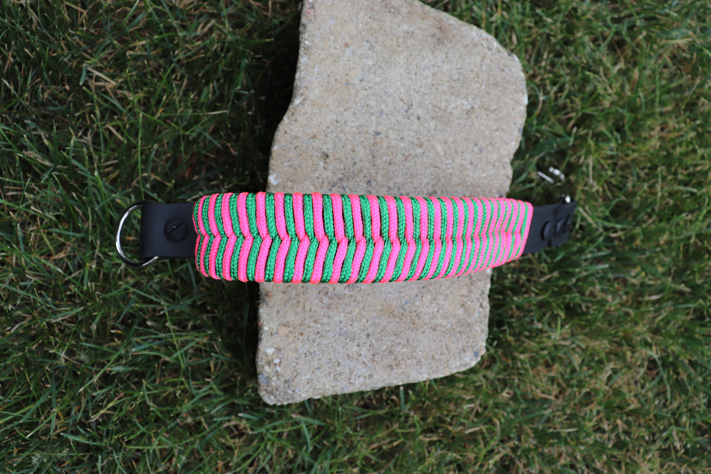Item: Fishtail braid traffic handle alternate view | Material: paracord | Colors: Hot Pink & Green | Custom: Decorative and functional handle option