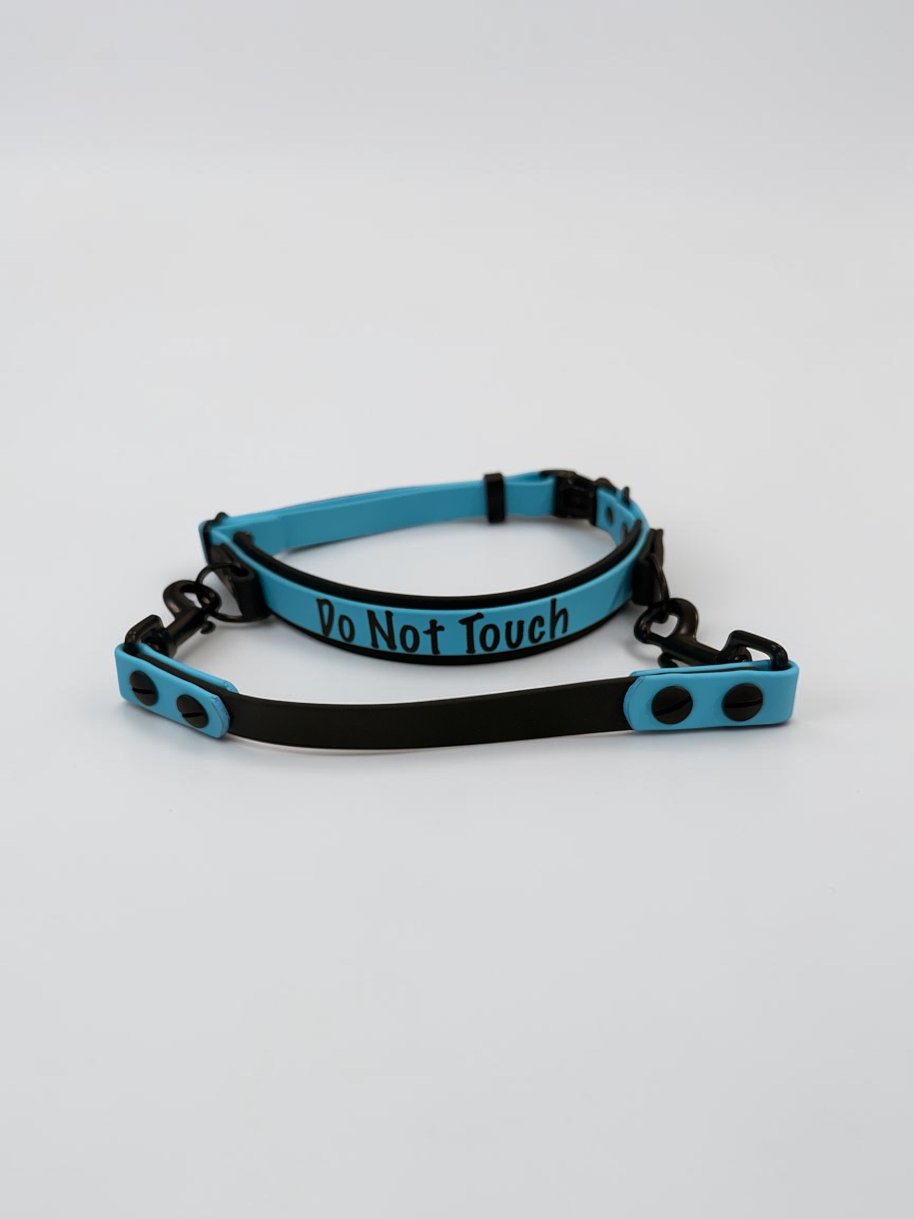 Item: Custom 2-layer collar with detachable handle | Width: Collar is 1 in & 5/8 in, handle is 5/8 in | Colors: Black base with Light Blue accent | Hardware: black | Custom: Integrated control handle for extra grip or quick grab, HTV details on collar