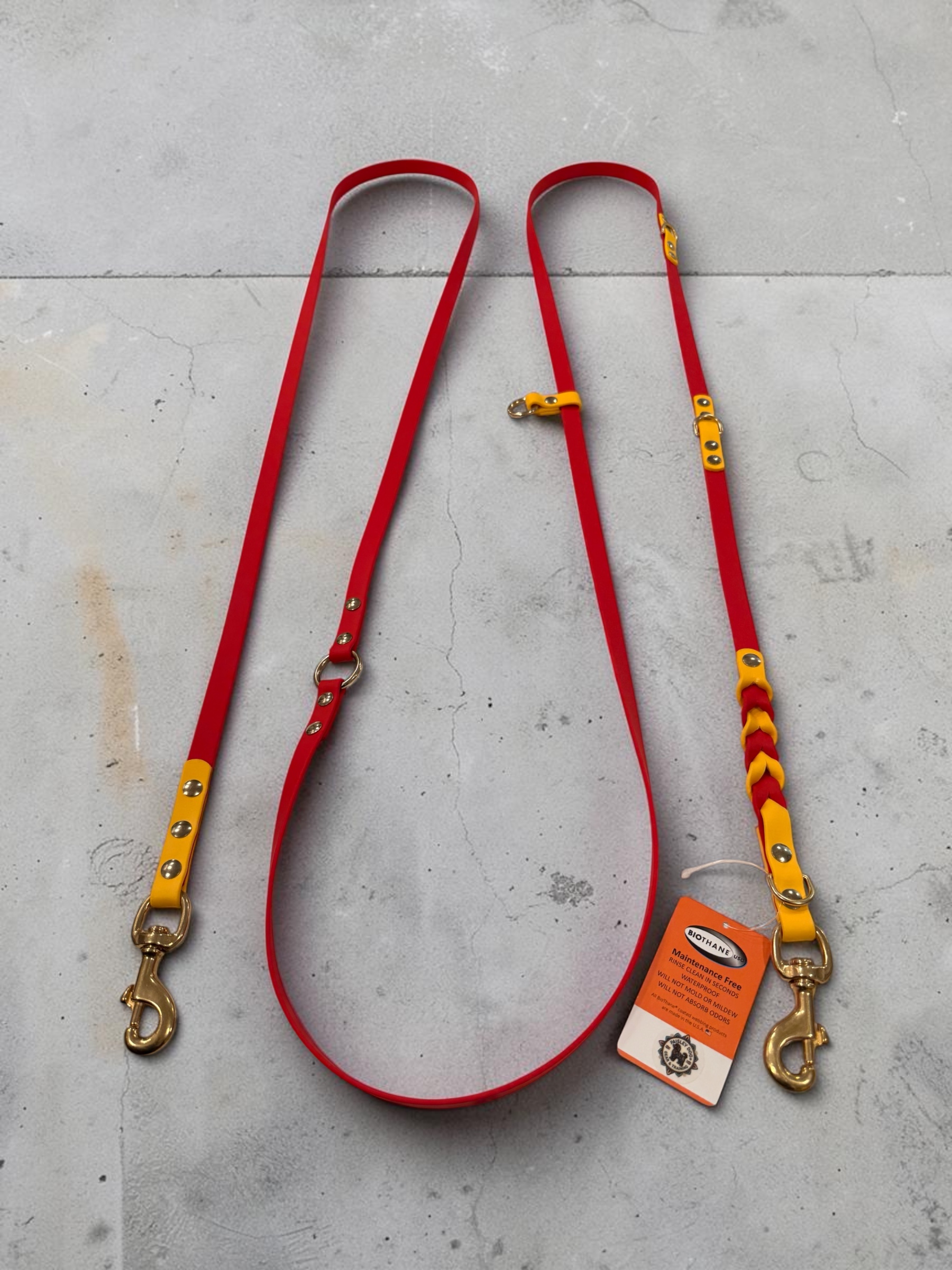 Item: Custom braided hands-free leash | Width: 5/8 in | Colors: Red and Yellow | Hardware: brass