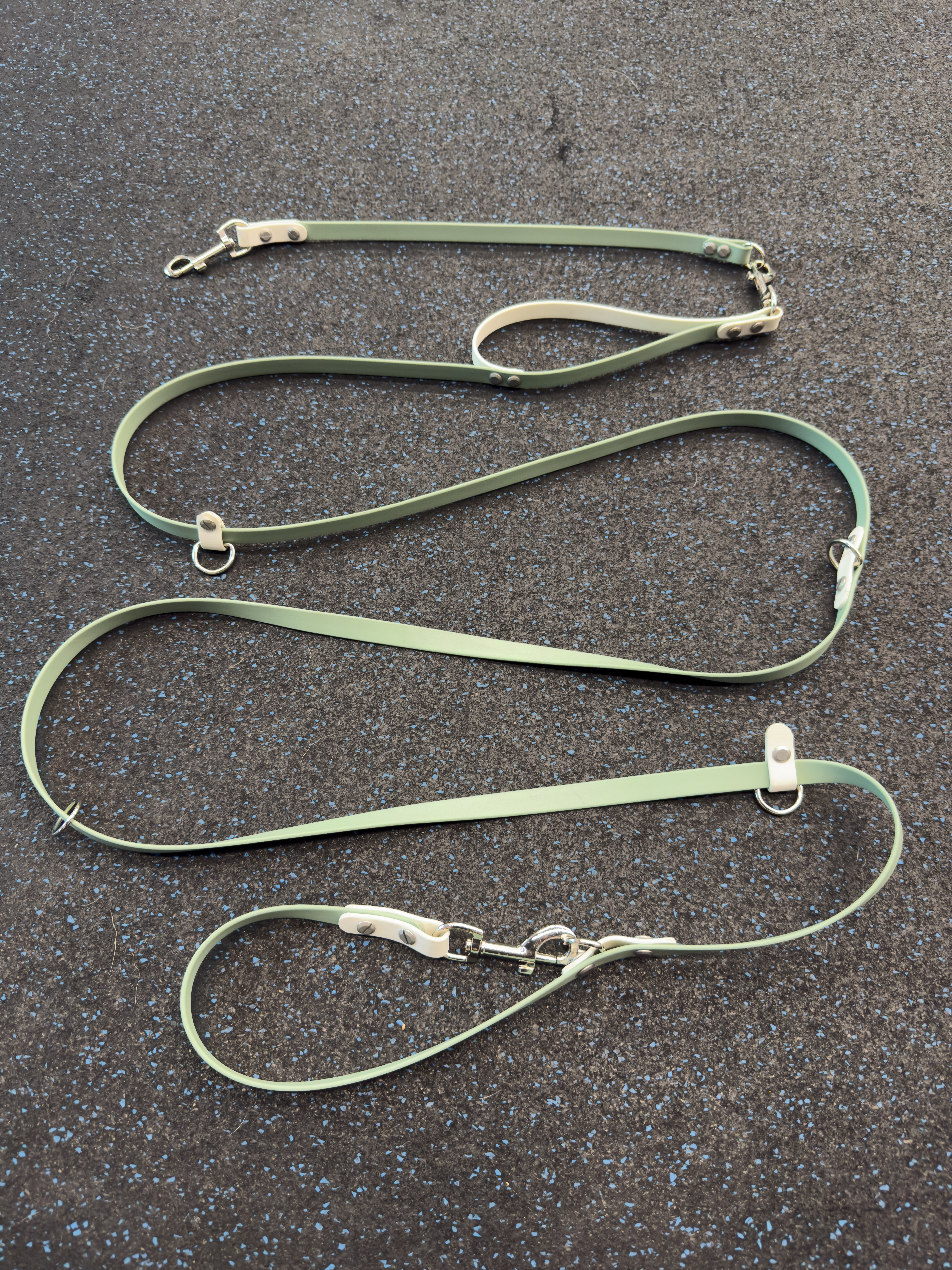 Item: The Tallulah / hands-free leash system | Length: 7 ft | Width: 5/8 in | Colors: Sage & White | Hardware: silver | Custom: Built-in traffic handle at base and matching leash extender