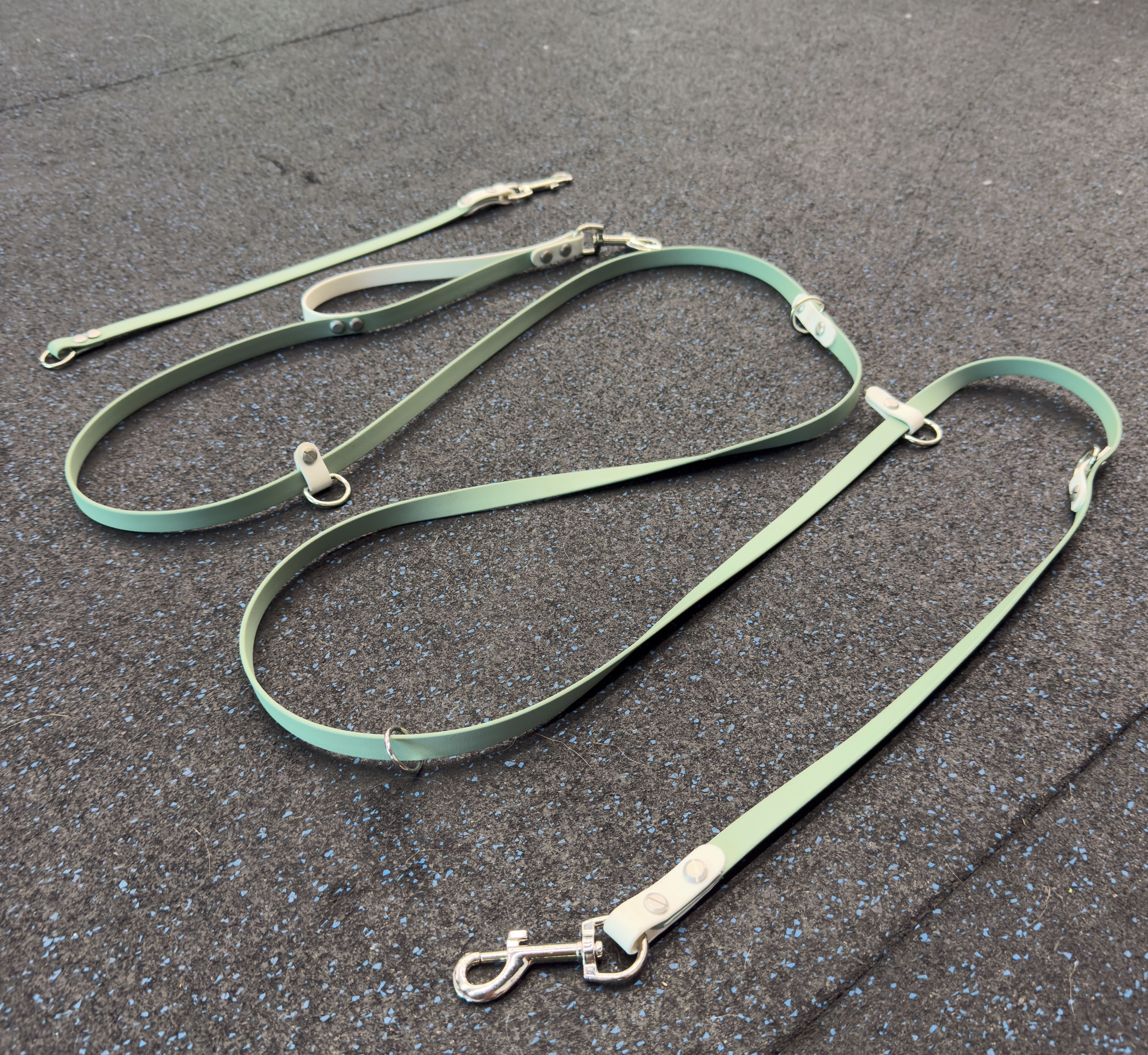 Item: The Tallulah / hands-free leash system | Length: 7 ft | Width: 5/8 in | Colors: Sage & White | Hardware: silver | Custom: Built-in traffic handle at base and matching leash extender
